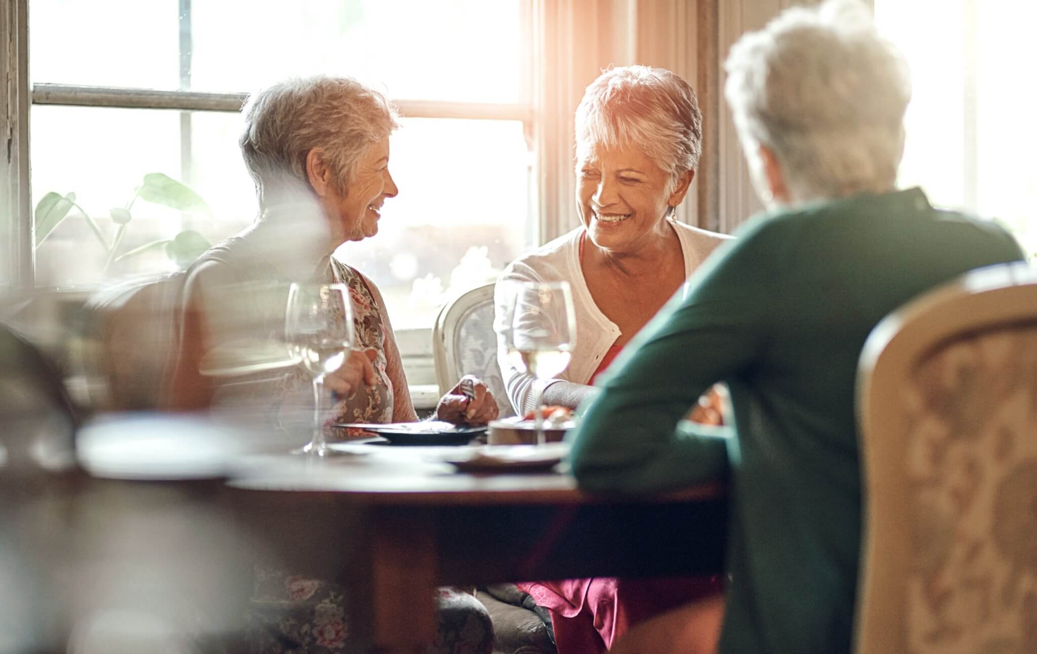 Senior,Women,,Friends,And,Smile,In,Restaurant,For,Wine,,Vacation